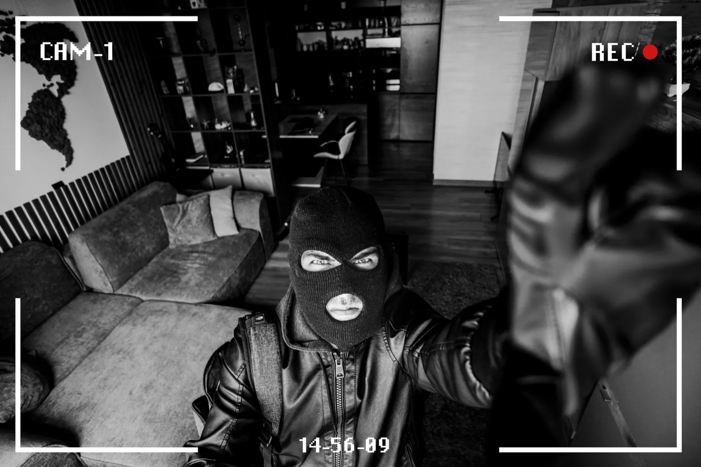 Burglar reaching for security camera - footage already safe in cloud