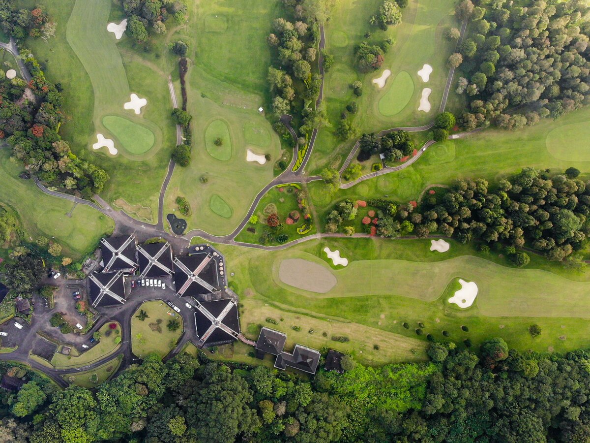 A golf and leisure estate from the air - clubhouse, car park, fairways and bunkers in one frame